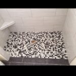 A black and white tiled bathroom floor.