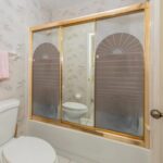 A bathroom with a toilet and shower, perfect for a bathroom remodel.