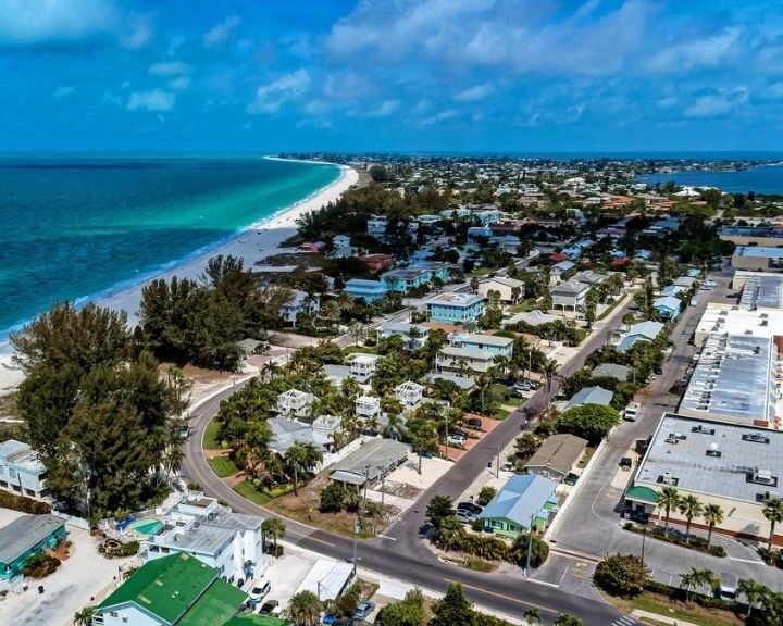 An aerial view of the beach and houses in Key West, Florida, showcasing the beautiful coastline.