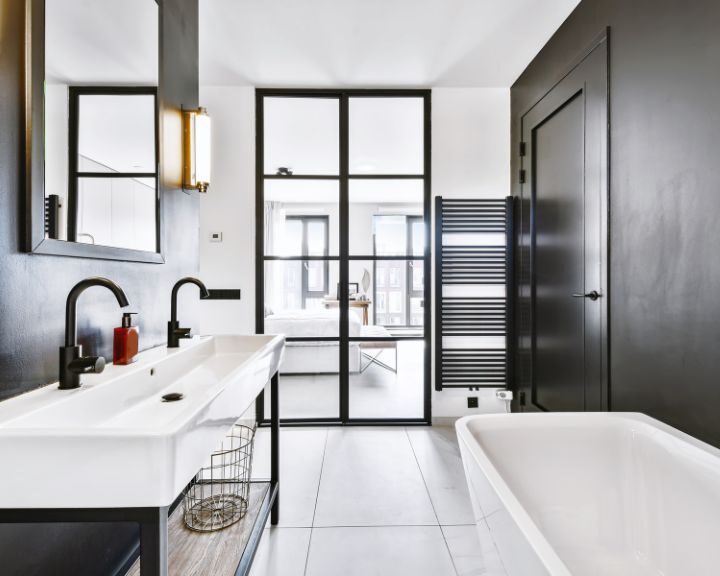 A black and white bathroom with a tub.